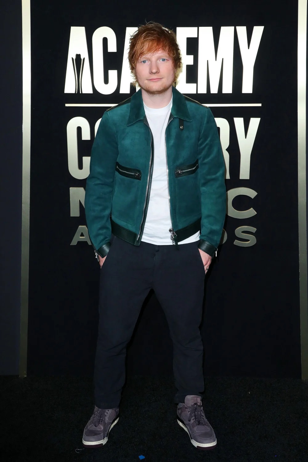 Ed Sheeran looked effortless in a green jacket and sneakers.
